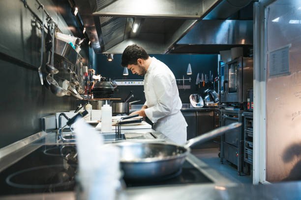 chef cooking in a luxury restaurant - food stock pictures, royalty-free photos & images