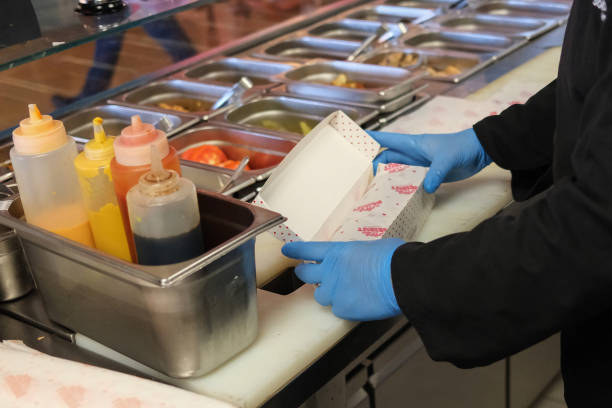 Chef packages takeaway food at a Dubai restaurant on September 4, 2024. Climate negotiators hope to reach the world's first treaty on plastic...