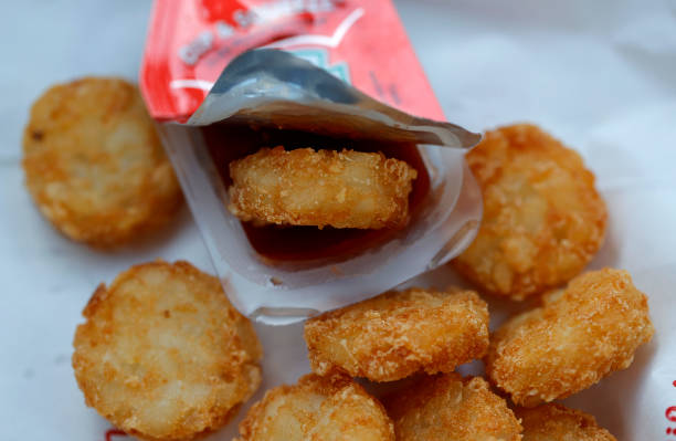 Chick-fil-A hash brown sits in a packet of Heinz ketchup on April 12, 2021 in Novato, California. Packets of ketchup are in short supply as takeout...