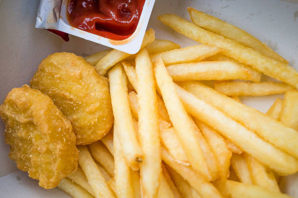 chicken nuggets and fries - junk food stock pictures, royalty-free photos & images