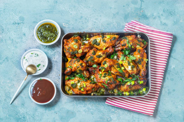 chicken wings in salsa verde - junk food stock pictures, royalty-free photos & images