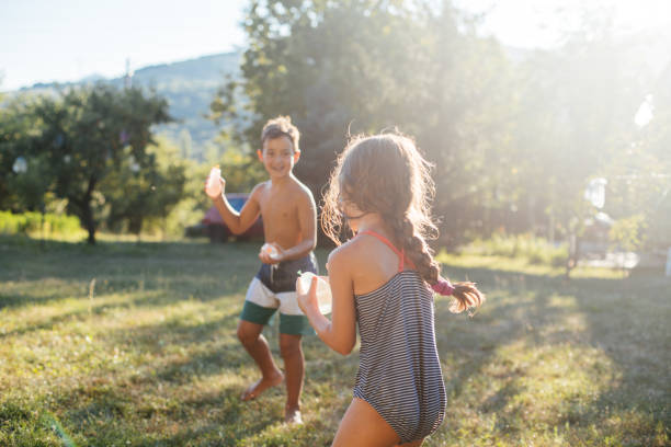 childre's summer fun outdoor activities - garden decoration stock pictures, royalty-free photos & images