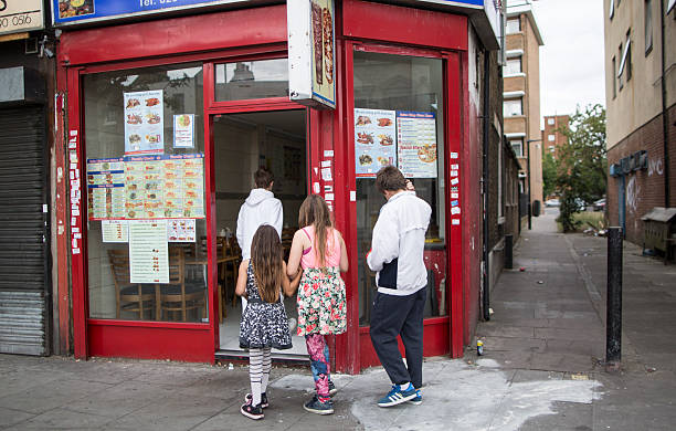 Children make their way into a fast food outlet in Tower Hamlets on August 10, 2015 in London, England.