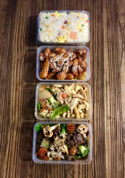 chinese take away food in plastic containers. - junk food stock pictures, royalty-free photos & images