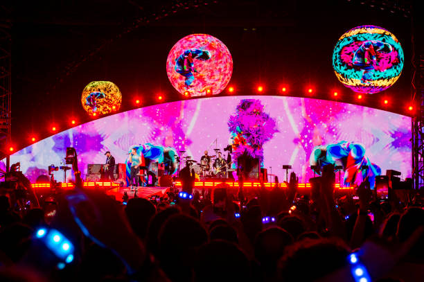 Chris Martin , Jonny Buckland , Will Champion and Guy Berryman of the group Coldplay Performs at Stadio Olimpico on July 12, 2024 in Rome, Italy.
