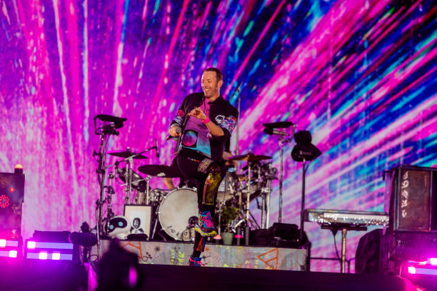 Chris Martin of Coldplay performs live on stage at Parken Stadium on July 5, 2023 in Copenhagen, Denmark.