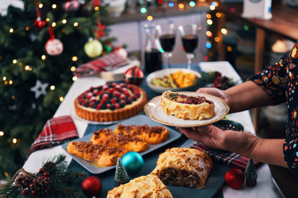 christmas dinner with vegan mushroom beef wellington, butternut squash, green beans and berry pie - food stock pictures, royalty-free photos & images