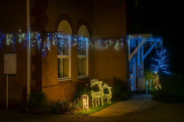 christmas lights on a suburban residential house - garden decoration stock pictures, royalty-free photos & images