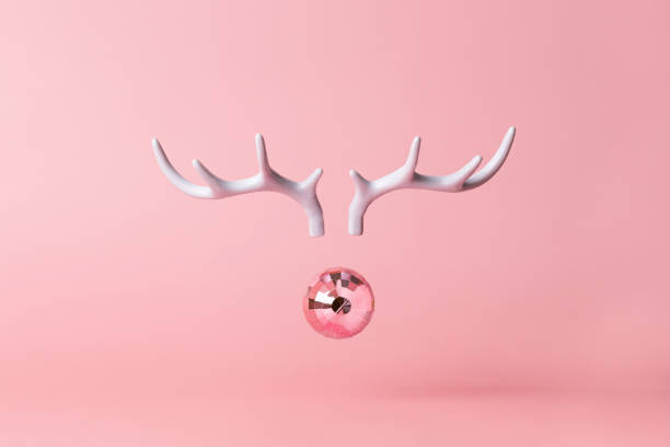 christmas reindeer concept on pink background made horns and xmas party ball on pastel pink background. minimal winter vacation idea. - home decoration stock pictures, royalty-free photos & images