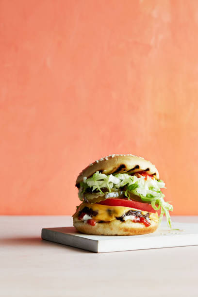 classic burger - junk food stock pictures, royalty-free photos & images