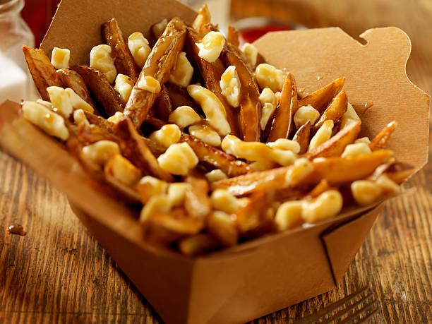 classic french canadian poutine - junk food stock pictures, royalty-free photos & images