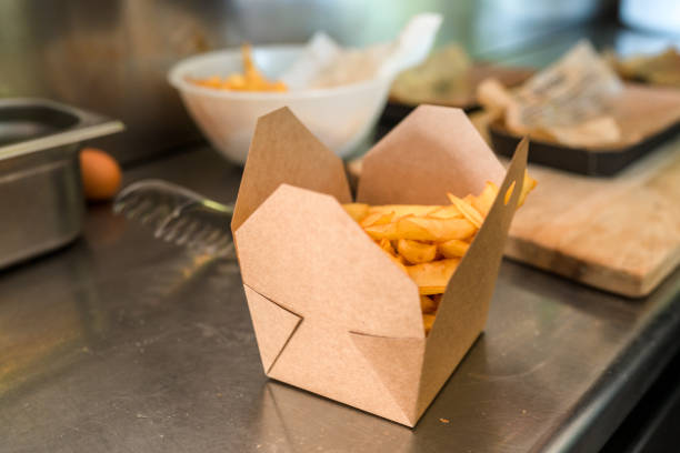 classic french fries on a box - junk food stock pictures, royalty-free photos & images