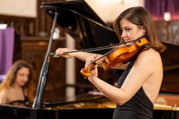 classical music concert with piano and violin - concert stock pictures, royalty-free photos & images