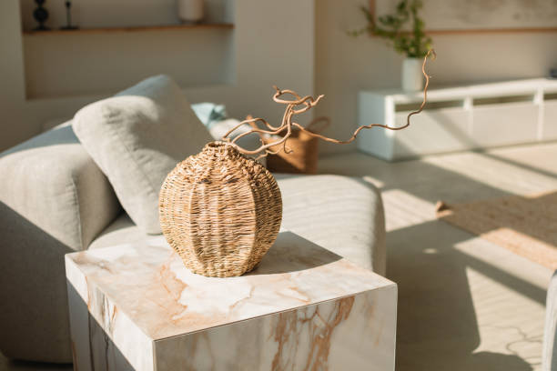 close-up of a wicker vase on a coffee table in a living room - home decoration stock pictures, royalty-free photos & images