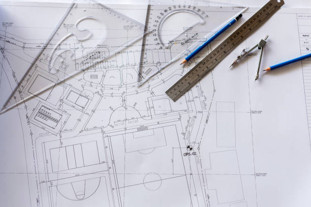 close-up of architect engineer drawing plan on blueprint with architect equipment - home decoration stock pictures, royalty-free photos & images