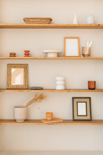 close-up of assorted ornaments, vases and mirrors on shelves - home decoration stock pictures, royalty-free photos & images