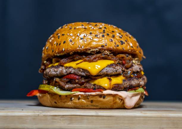 close-up of burger on table,indonesia - junk food stock pictures, royalty-free photos & images