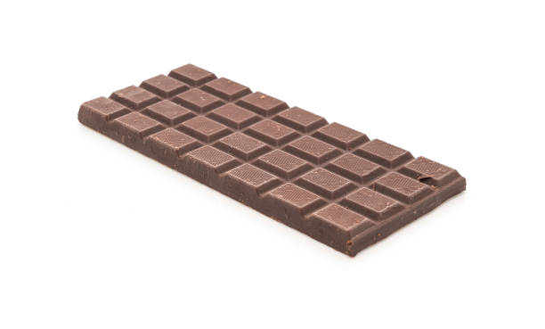 close-up of chocolate bar against white background,romania - junk food stock-fotos und bilder