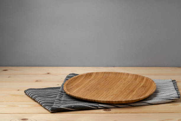 close-up of cutting board on table against wall - food stock pictures, royalty-free photos & images