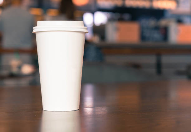 close-up of disposable cup on table - junk food stock pictures, royalty-free photos & images