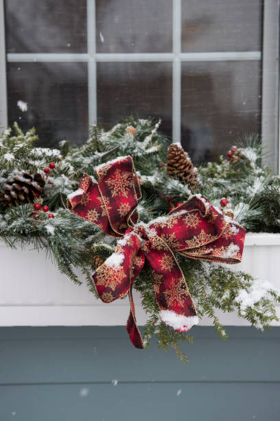 close-up of frozen christmas decoration on window sill - home decoration stock pictures, royalty-free photos & images
