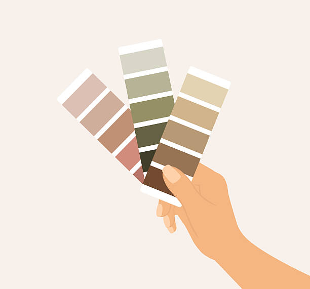 close-up of hand holding color swatches against wall. comparing paint options for interior design or renovation - home decoration stock illustrations