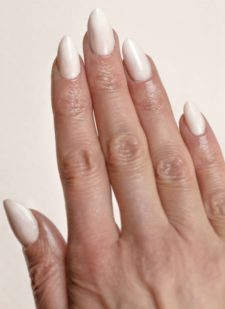 close-up of woman fingers with nail art, nude manicure - nails art stock pictures, royalty-free photos & images