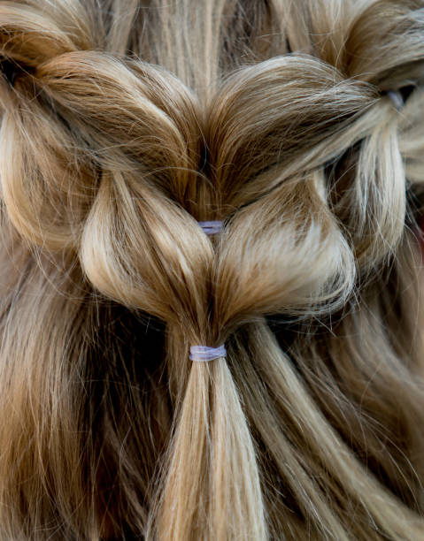 close-up on a beautiful braided hairdo - hairstyle stock pictures, royalty-free photos & images