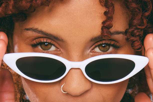 close-up portrait of a cool young woman's eyes - fashion stock pictures, royalty-free photos & images