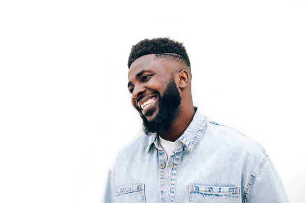 close-up portrait of smiling young african man isolated on white background. - hairstyle stock pictures, royalty-free photos & images