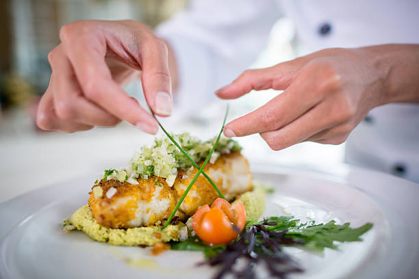 close up of a chef decorating a plate - food stock pictures, royalty-free photos & images