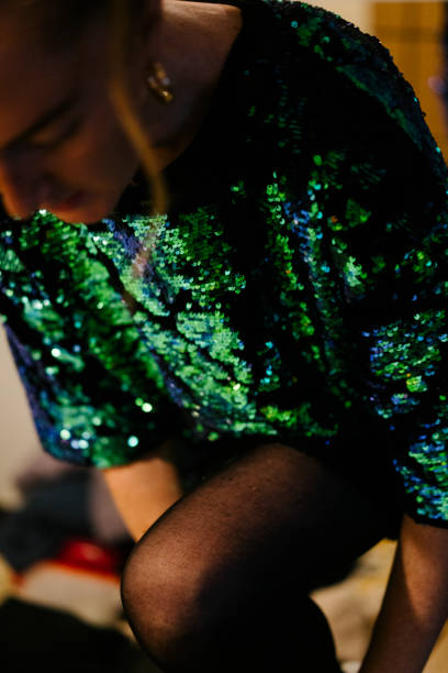 close up of a young woman wearing a sequin dress - fashion stock pictures, royalty-free photos & images