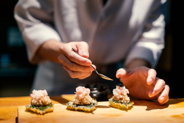 close up of chef making nigiri sushi - food stock pictures, royalty-free photos & images