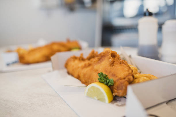 close up of traditional fish and chips - junk food stock pictures, royalty-free photos & images