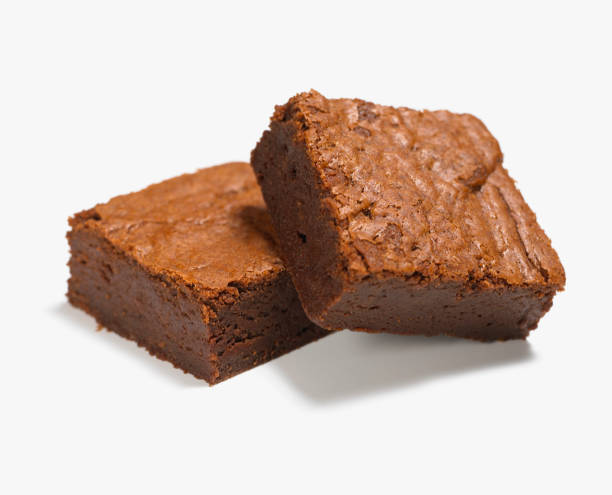 close up of two chocolate brownies - junk food stock pictures, royalty-free photos & images