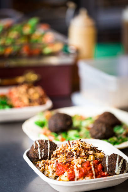 close up of vegan vegetarian take away food at food market - junk food stock pictures, royalty-free photos & images