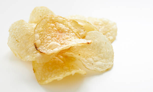 close up on potato chips - junk food stock pictures, royalty-free photos & images