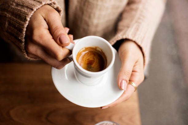 coffee cup, lady's hands holding coffee cup, woman holding a white mug, espresso in white cup - coffee stock pictures, royalty-free photos & images