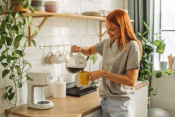 college student at dorm room - coffee stockfoto's en -beelden