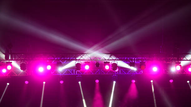 colorful pink spotlights above stage during performance. - concert stock pictures, royalty-free photos & images