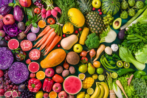 colorful raw fruits and vegetables varied vegan food, vivid rainbow arrangement - food stock pictures, royalty-free photos & images