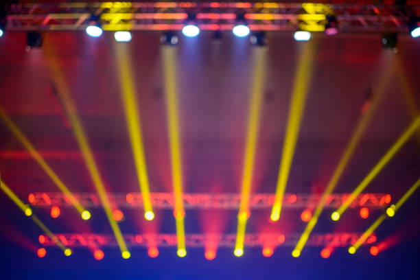 colorful spotlights above stage during music performance. - concert stock pictures, royalty-free photos & images