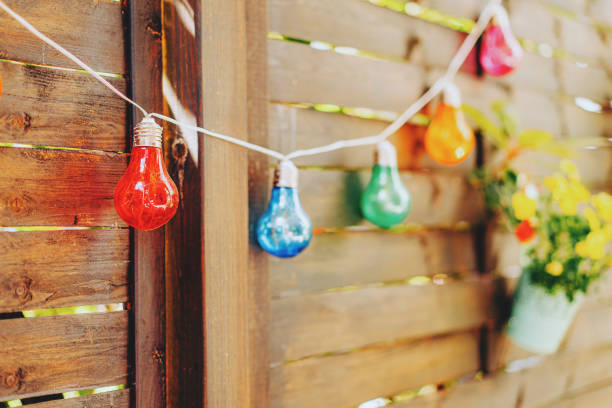 colorful string lights for party decoration - garden decoration stock pictures, royalty-free photos & images