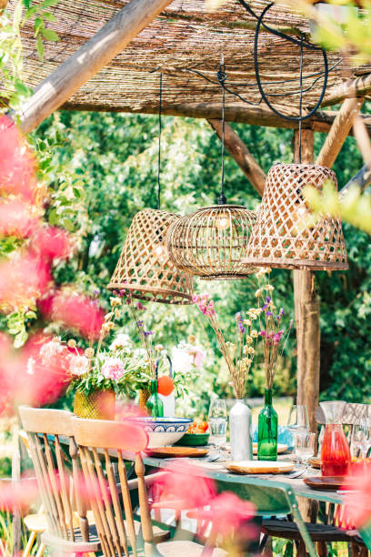 colourful decorated table in summer setting. garden party. lunch. summer garden patio terrace. - garden decoration stock pictures, royalty-free photos & images