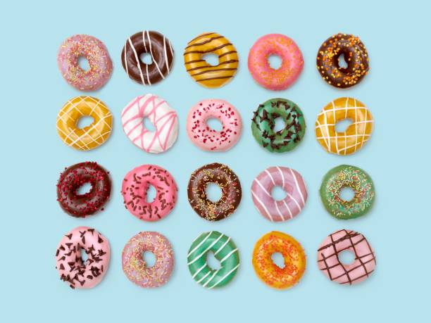 colourful doughnuts - junk food stock pictures, royalty-free photos & images