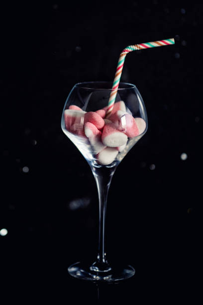 concept of how many gummies you eat when you drink a sugary drink. - junk food stock pictures, royalty-free photos & images