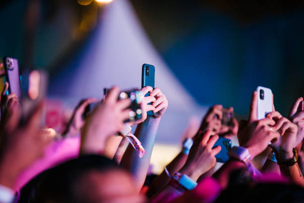 Concert-goers use their smartphones during Karol G concert as part of 'Mañana Será Bonito' Tour at Centro Esportivo Tietê on May 10, 2024 in Sao...