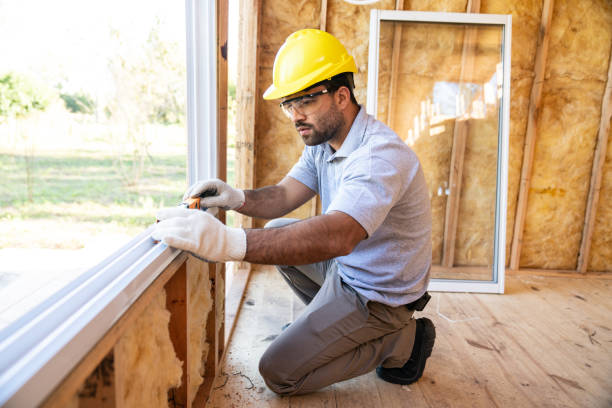 construction worker installing windows on wooden house - home decoration stock pictures, royalty-free photos & images