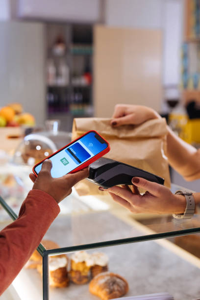 contactless payment by phone - junk food stock pictures, royalty-free photos & images