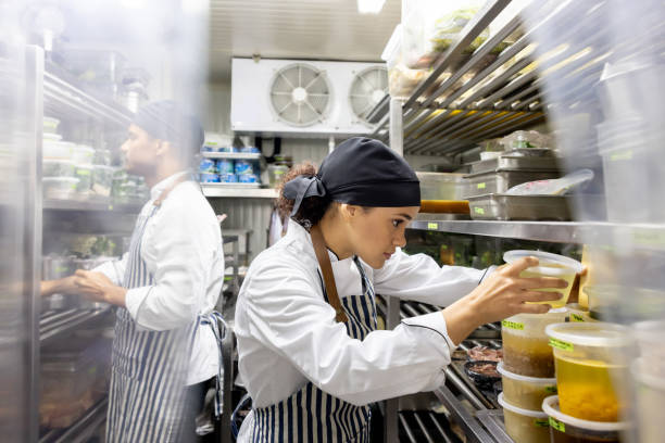 cooks working at a restaurant and looking for ingredients in the pantry - food stock pictures, royalty-free photos & images